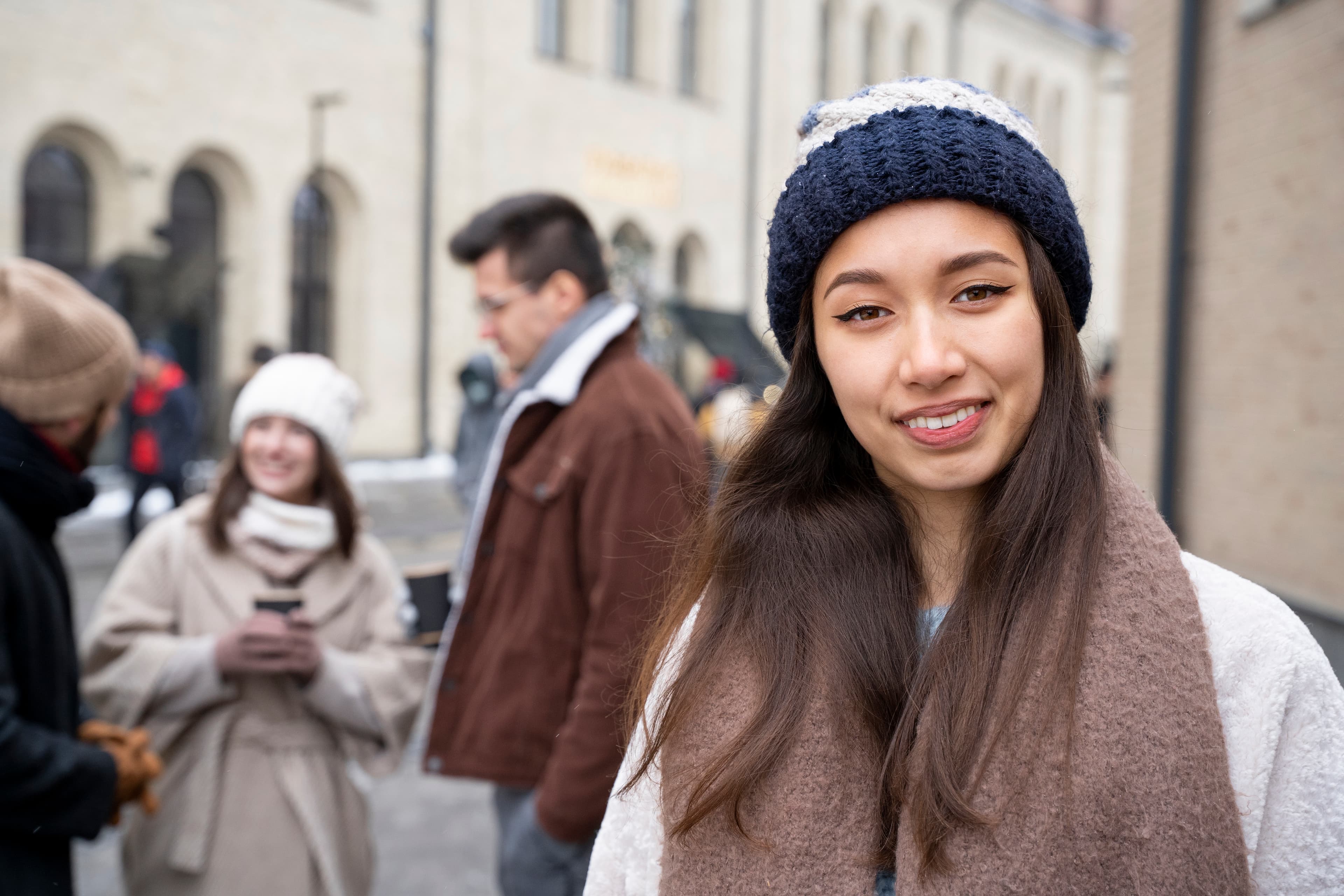 Young woman smiling on a winter street in Brampton