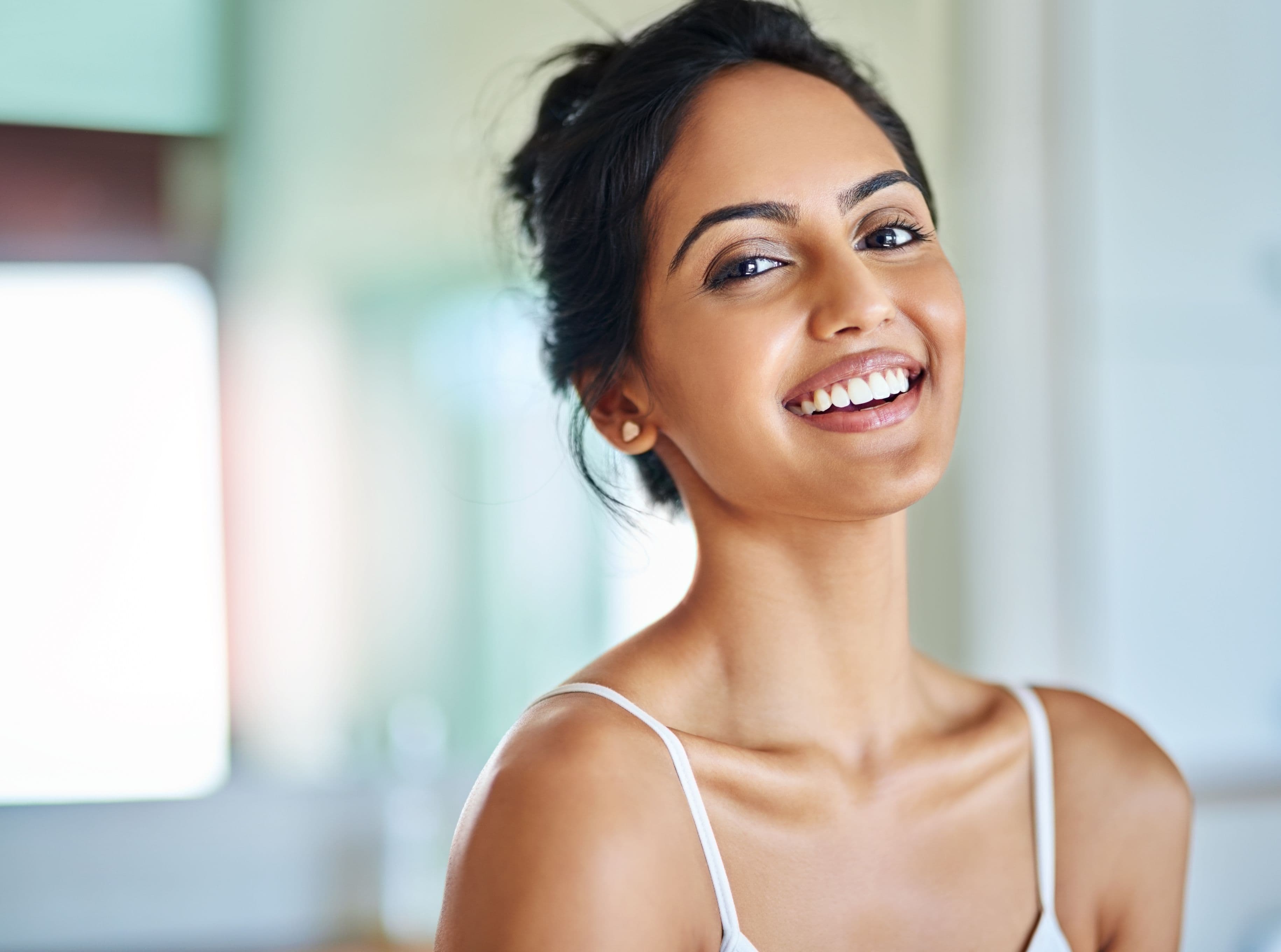 Patient smiling with a bright, healthy smile after teeth whitening